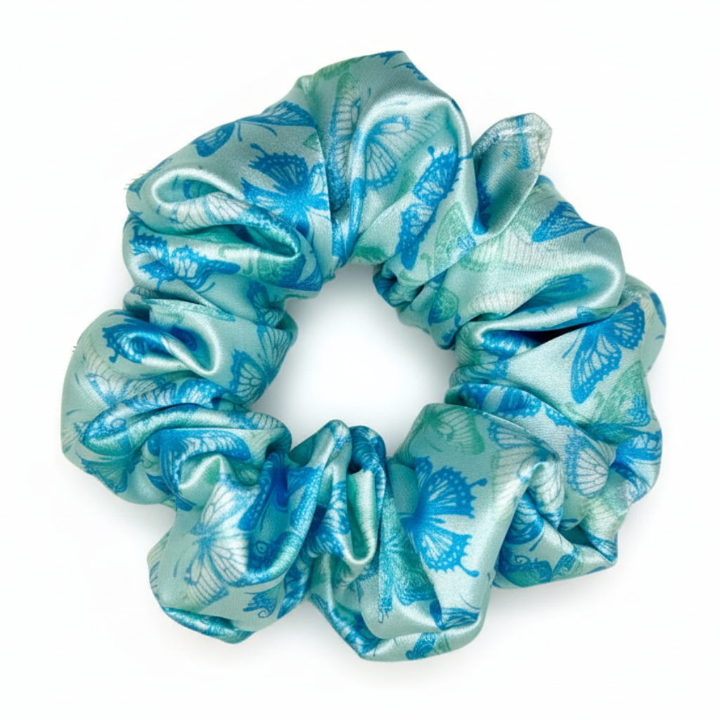 Turquoise butterfly silk scrunchie on white background